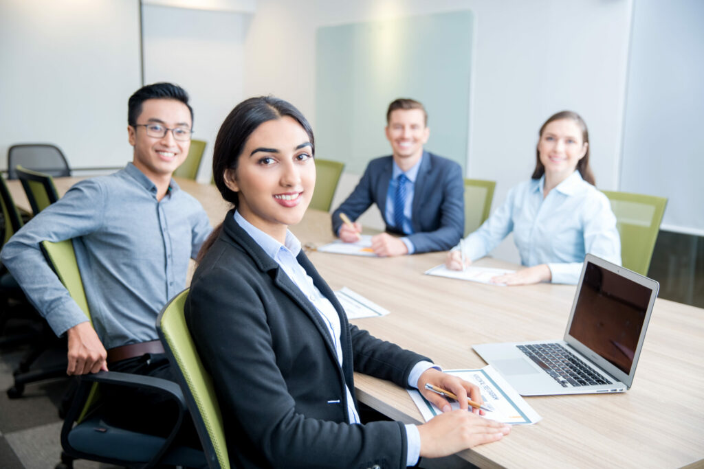 Smiling Business Lady Working with Colleagues Related to SAP course or training